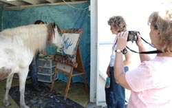 Pat and Linda watch Juliet paint